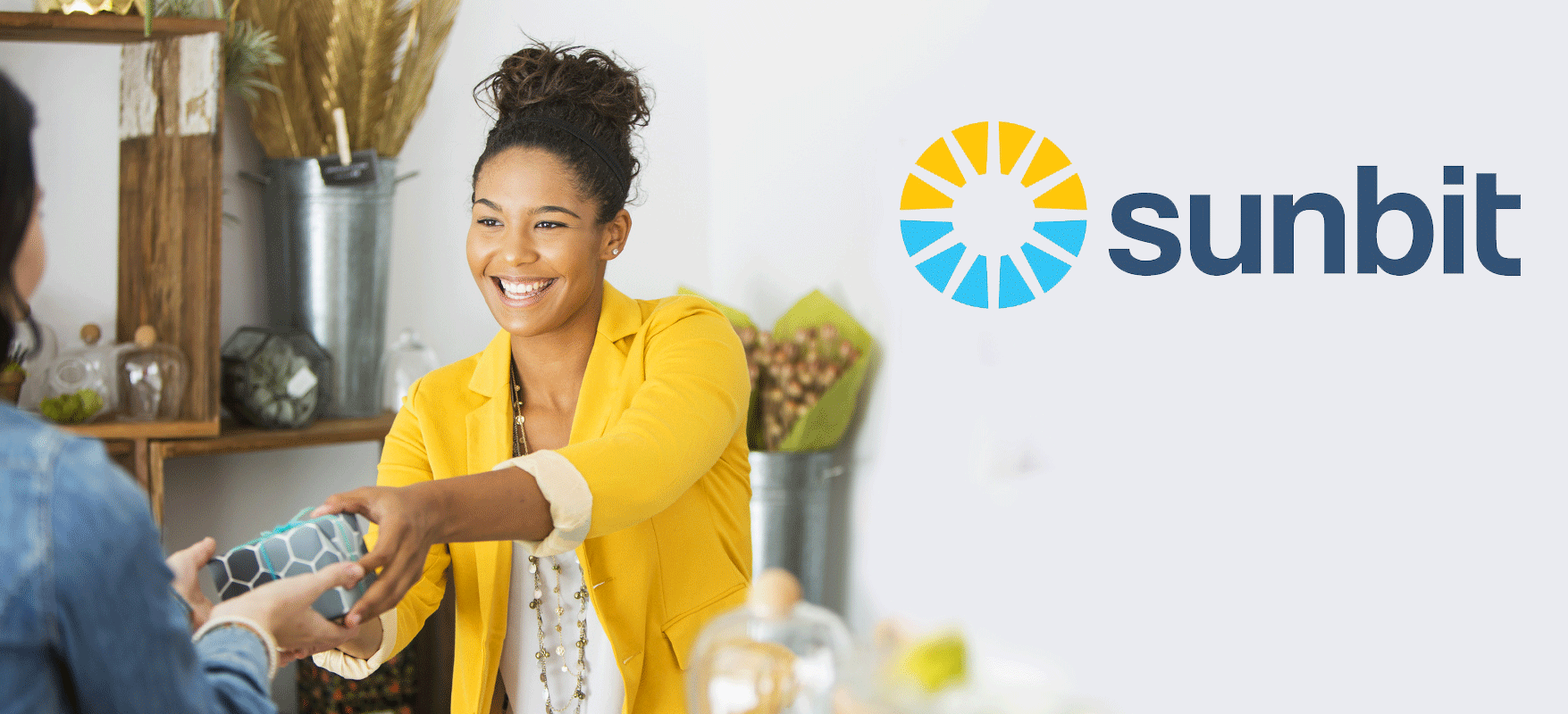 Woman smiling receiving gift